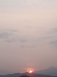 Low angle view of silhouette mountain against sky during sunset