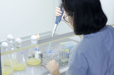 Scientist working at table in laboratory