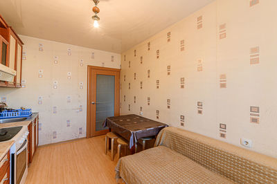 Empty chairs and tables in building