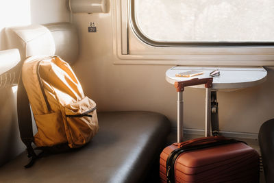 Rear view of woman sitting in train