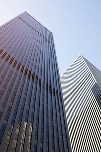 Low angle view of modern buildings against clear sky