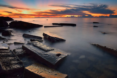 Scenic view of sea at sunset