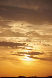 Low angle view of dramatic sky during sunset