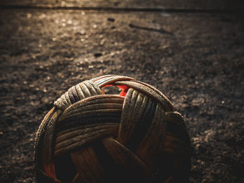 Close-up of rope tied on metal field