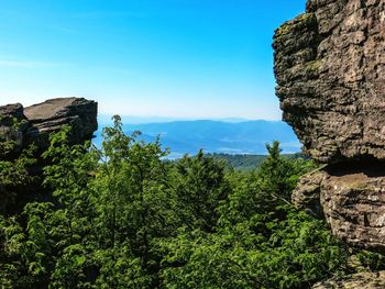 Scenic view of mountains against blue sky