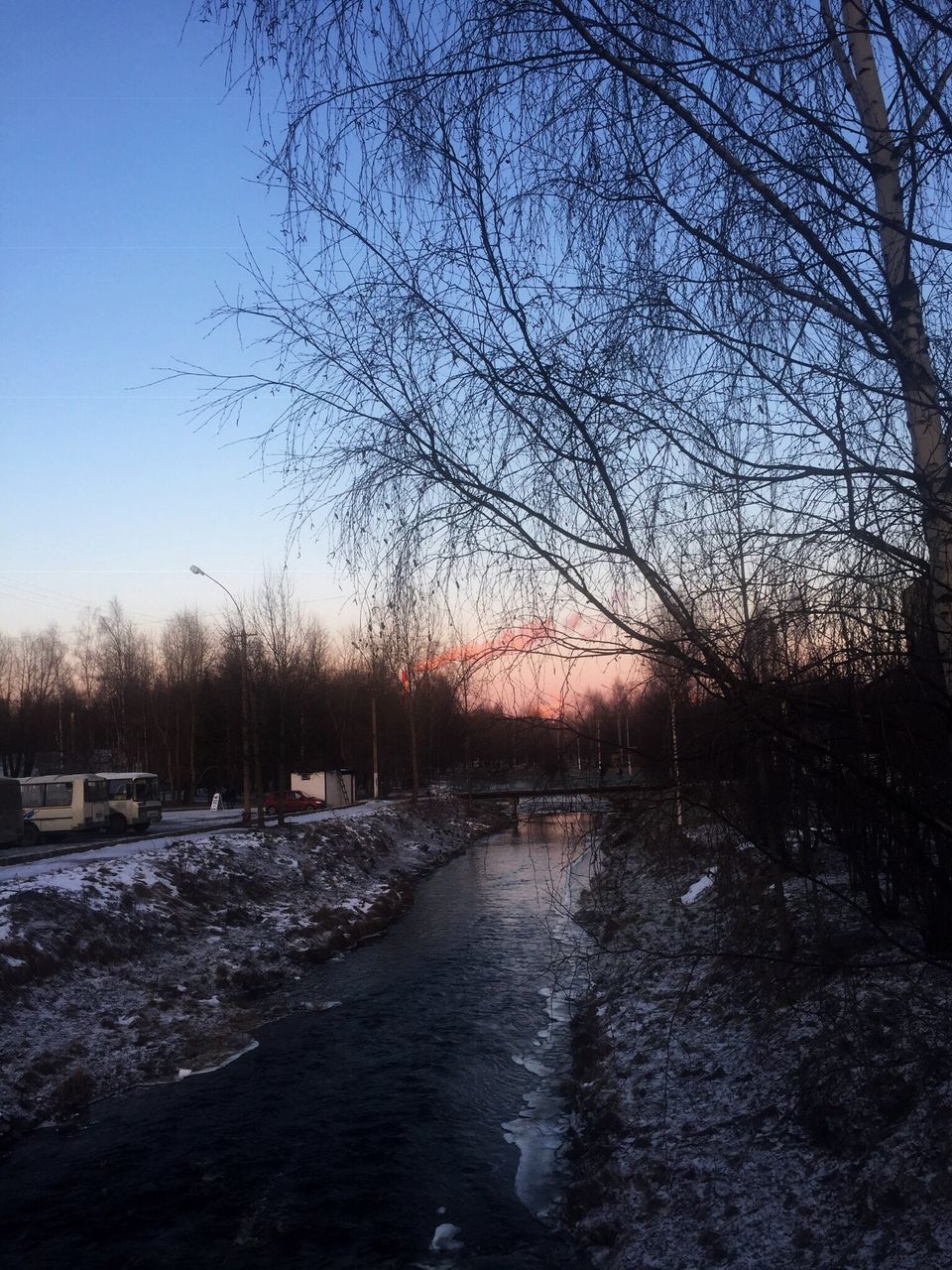 SCENIC VIEW OF RIVER DURING WINTER AGAINST SKY