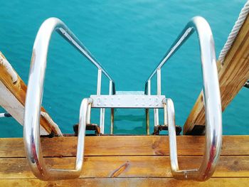 High angle view of metallic stairs towards sea