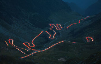 High angle view of illuminated road at night