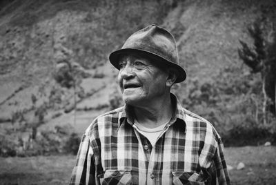 Portrait of man wearing hat looking away