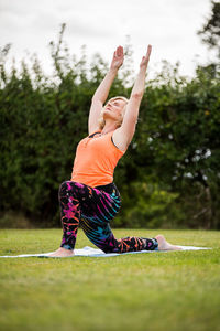 Full length of man with arms raised