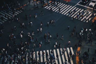 High angle view of people walking on road