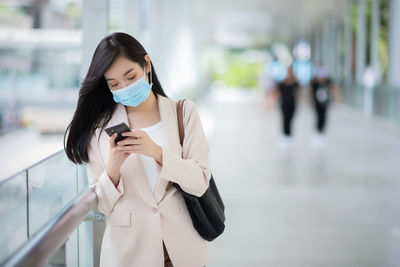 Young woman using mobile phone