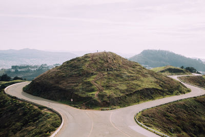 Mountain amidst road against sky