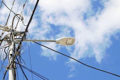 Low angle view of street light against sky