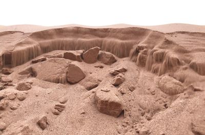 Sand dune in desert against sky