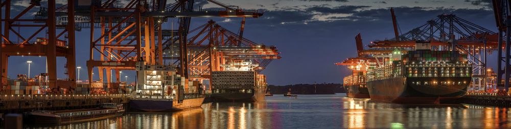 Commercial dock by pier against sky