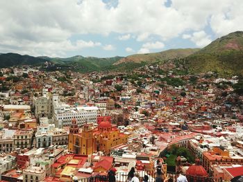 Aerial view of cityscape against sky