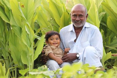 Portrait of a smiling boy with smiling grandfa