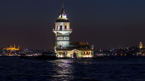 Illuminated buildings in city at night