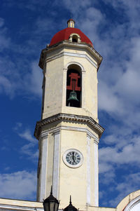 Low angle view of clock tower against sky