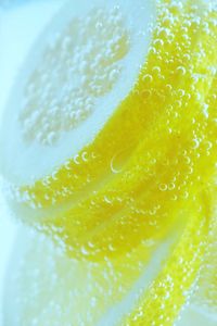 Close-up of lemon in soda