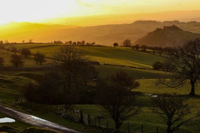 Scenic view of landscape against sky during sunset