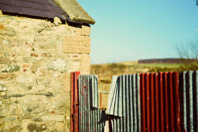 Close-up of built structure against clear sky