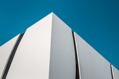 Low angle view of building against clear blue sky