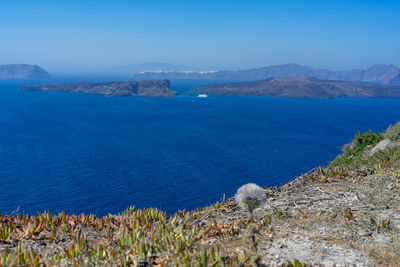 Beautiful panoramic view from akrotiri to caldera and volcano on a sunny day. santorini island