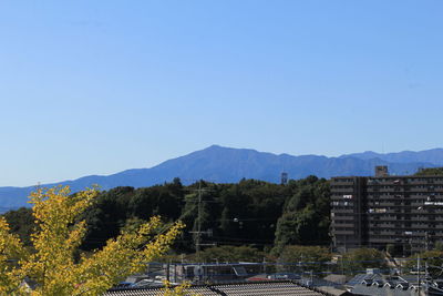 Scenic view of mountains against clear blue sky