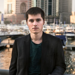 Portrait of young man standing outdoors