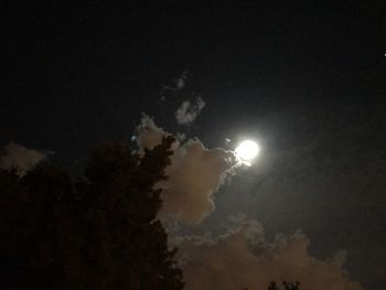 Low angle view of silhouette moon against sky at night