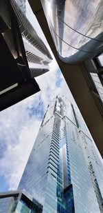 Low angle view of modern buildings against sky