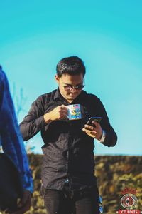 Young man using mobile phone