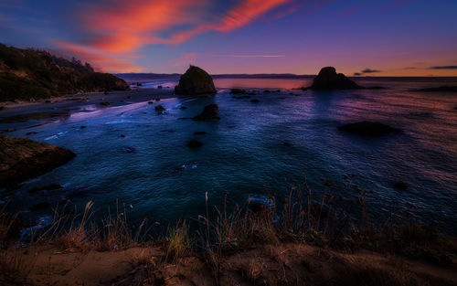 Scenic view of sea against sky at sunset