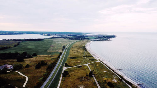 High angle view of road by sea against sky