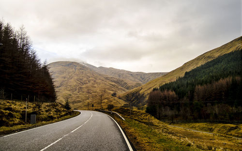 Country road leading towards mountains