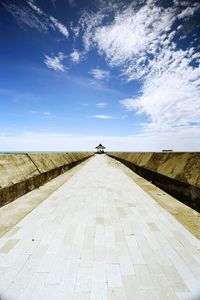 Man on road against sky