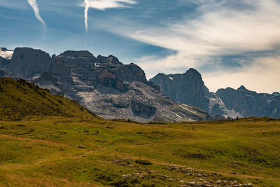 Scenic view of landscape and mountains against sky