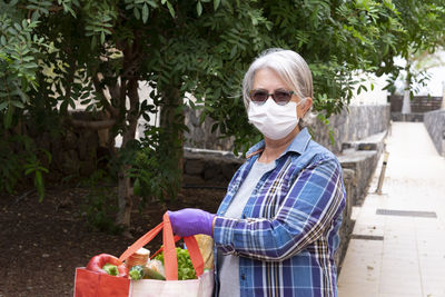 Woman with shopping bag outdoors