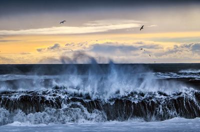 Scenic view of sea against sky during sunset