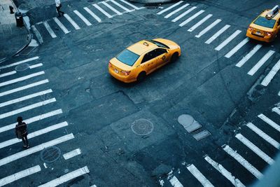 High angle view of yellow cabs on street in nyc