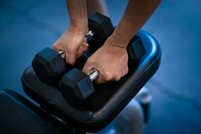 Low section of woman exercising in gym