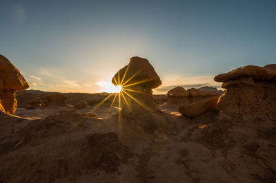 Panoramic view of rocks against sky during sunset