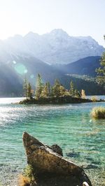 Scenic view of lake and mountains against sky