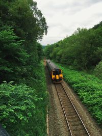 Train on railroad track against sky