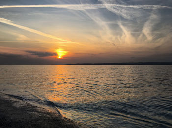 Scenic view of sea against sky during sunset