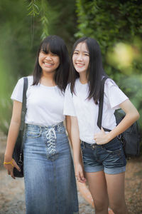 Portrait of cute girls standing outdoors