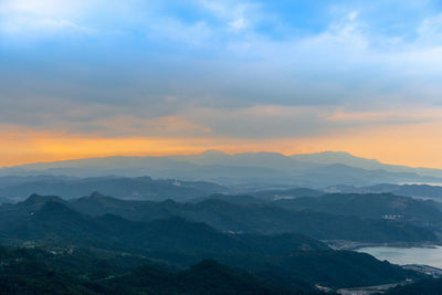 Scenic view of mountains against dramatic sky
