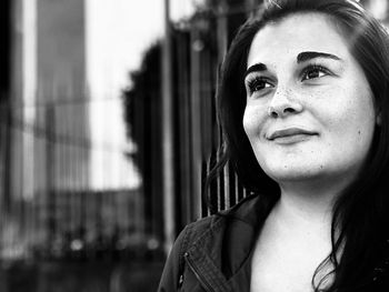 Close-up of smiling young woman outdoors